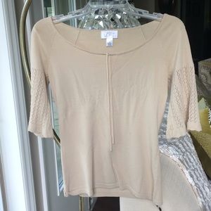 A Loft cream top with small details in sleeves